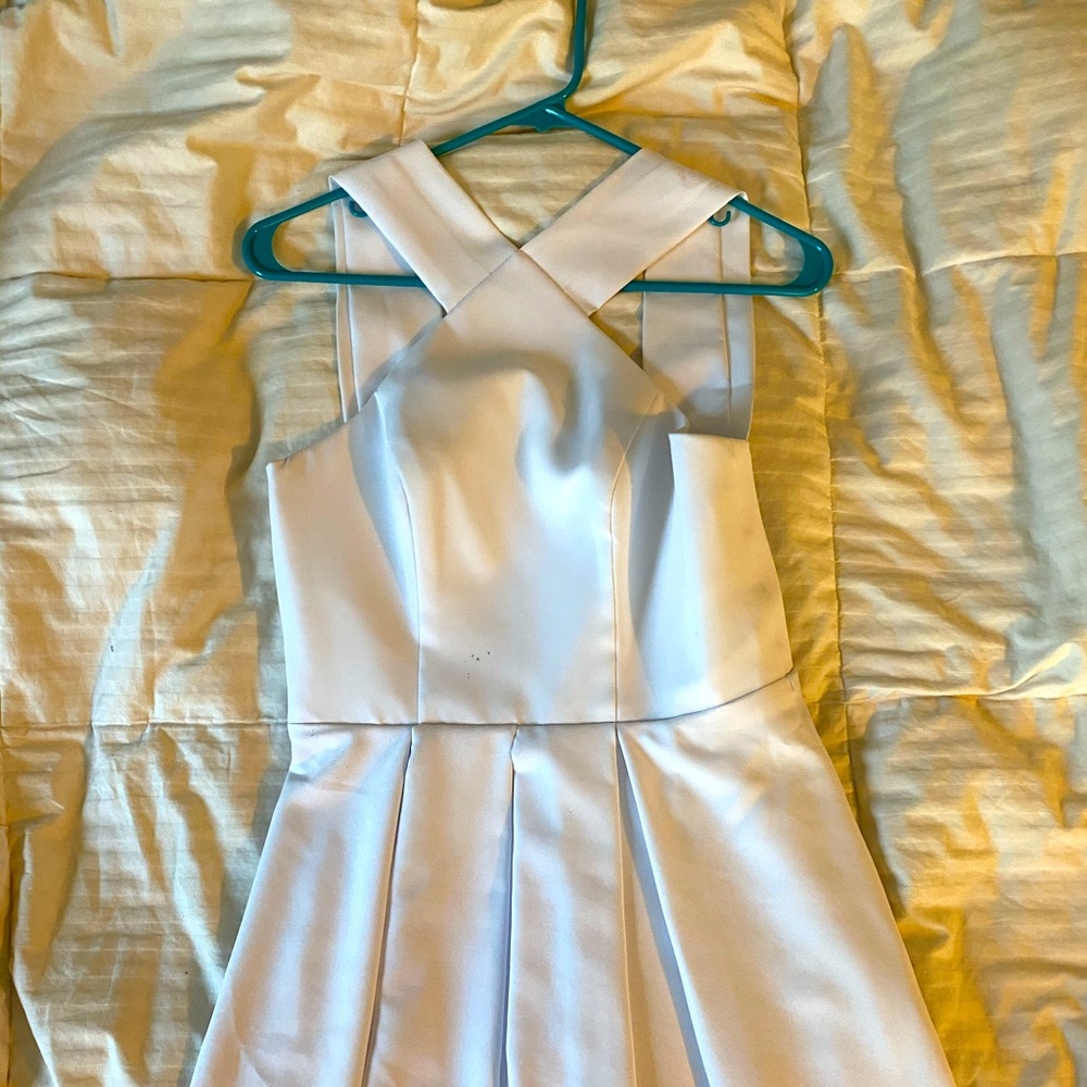 Knee length all white cross neck homecoming dress